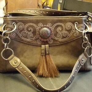 Blazin Roxx, Brown purse. Concho with horsehair tassels. Conceal carry.